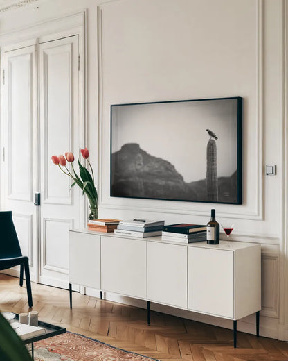 Desert Hunter by Nathan Larson. shown as a framed stretched canvas in a living room above a console. Available as a archival giclee rolled canvas, fine art paper, or poster print. SKU 90438i.