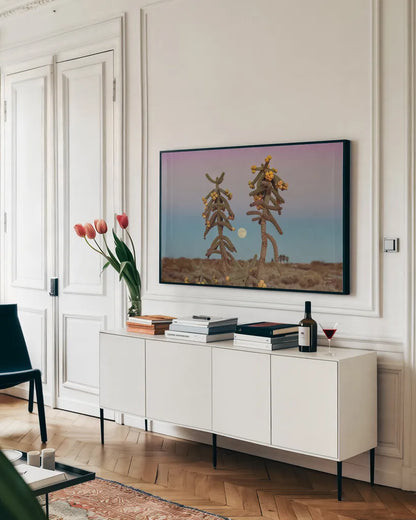 Desert Moonrise by Nathan Larson. shown as a framed stretched canvas in a living room above a console. Available as a archival giclee rolled canvas, fine art paper, or poster print. SKU 76443i.