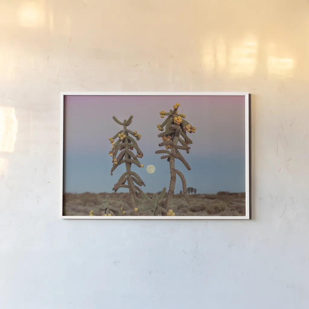 Desert Moonrise by Nathan Larson. shown as a paper print in a white frame. Available as a archival giclee rolled canvas, fine art paper, or poster print. SKU 76443i.