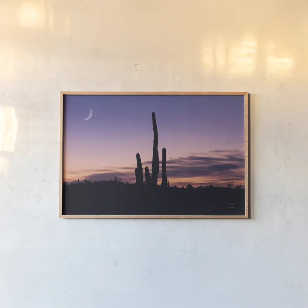 Desert Moons by Nathan Larson. shown as a paper print in a natural frame. Available as a archival giclee rolled canvas, fine art paper, or poster print. SKU 76440i.