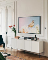Desert Song by Nathan Larson. shown as a framed stretched canvas in a living room above a console. Available as a archival giclee rolled canvas, fine art paper, or poster print. SKU 97579i.