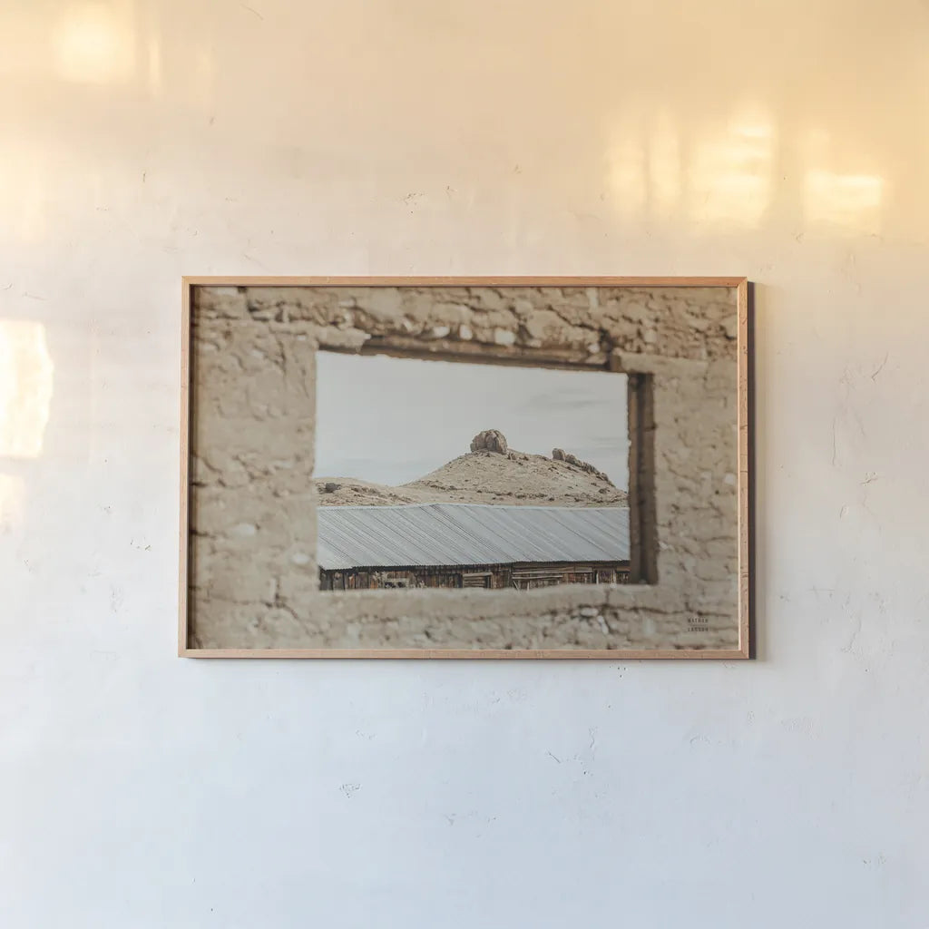 Desert Window by Nathan Larson. shown as a paper print in a natural frame. Available as a archival giclee rolled canvas, fine art paper, or poster print. SKU 81820i.