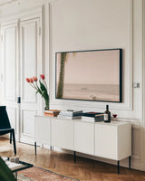 Dominican Fishing Boats by Nathan Larson. shown as a framed stretched canvas in a living room above a console. Available as a archival giclee rolled canvas, fine art paper, or poster print. SKU 73714i.