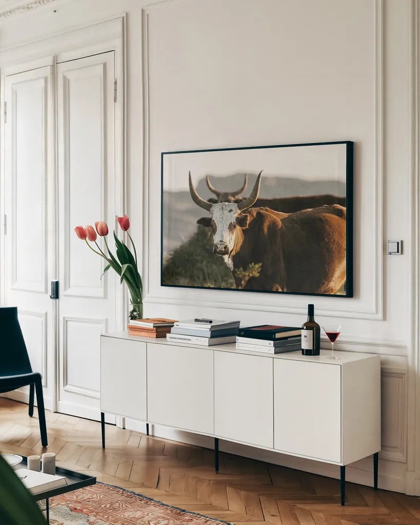 Double Horns by Nathan Larson. shown as a framed stretched canvas in a living room above a console. Available as a archival giclee rolled canvas, fine art paper, or poster print. SKU 102616i.