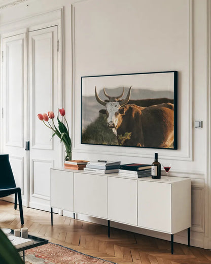 Double Horns by Nathan Larson. shown as a framed stretched canvas in a living room above a console. Available as a archival giclee rolled canvas, fine art paper, or poster print. SKU 102616i.