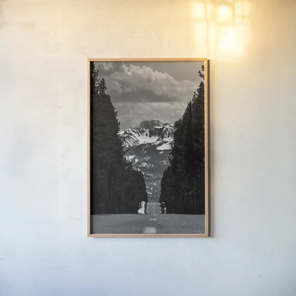 Driving into the Tetons by Nathan Larson. shown as a paper print in a natural frame. Available as a archival giclee rolled canvas, fine art paper, or poster print. SKU 92539h.