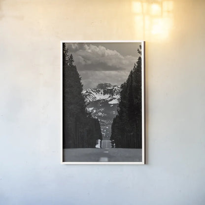 Driving into the Tetons by Nathan Larson. shown as a paper print in a white frame. Available as a archival giclee rolled canvas, fine art paper, or poster print. SKU 92539h.