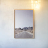 Dusty Desert Dreams Road by Nathan Larson. shown as a paper print in a natural frame. Available as a archival giclee rolled canvas, fine art paper, or poster print. SKU 72031h.