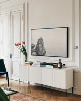 Edge of Land by Nathan Larson. shown as a framed stretched canvas in a living room above a console. Available as a archival giclee rolled canvas, fine art paper, or poster print. SKU 102285i.
