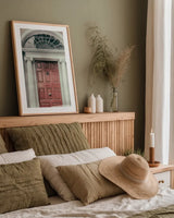 Faded Dublin Door Coral by Nathan Larson. shown as a paper print in a natural frame. Available as a archival giclee rolled canvas, fine art paper, or poster print. SKU 104278h.