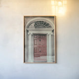 Faded Dublin Door Coral by Nathan Larson. shown as a paper print in a natural frame. Available as a archival giclee rolled canvas, fine art paper, or poster print. SKU 104278h.