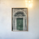 Faded Dublin Door Green by Nathan Larson. shown as a paper print in a natural frame. Available as a archival giclee rolled canvas, fine art paper, or poster print. SKU 104275h.