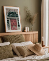 Faded Dublin Door Red by Nathan Larson. shown as a paper print in a natural frame. Available as a archival giclee rolled canvas, fine art paper, or poster print. SKU 104271h.