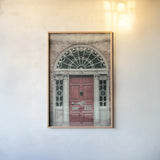 Faded Dublin Door Red by Nathan Larson. shown as a paper print in a natural frame. Available as a archival giclee rolled canvas, fine art paper, or poster print. SKU 104271h.