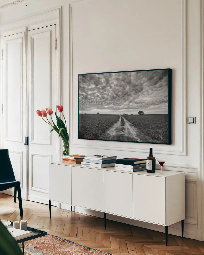 Farm Road by Nathan Larson. shown as a framed stretched canvas in a living room above a console. Available as a archival giclee rolled canvas, fine art paper, or poster print. SKU 73694i.