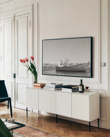 Fishing Boat Rest BW by Nathan Larson. shown as a framed stretched canvas in a living room above a console. Available as a archival giclee rolled canvas, fine art paper, or poster print. SKU 103183i.