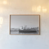 Fishing Boat Rest BW by Nathan Larson. shown as a paper print in a natural frame. Available as a archival giclee rolled canvas, fine art paper, or poster print. SKU 103183i.