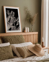 Flower Dreams BW I by Nathan Larson. shown as a paper print in a natural frame. Available as a archival giclee rolled canvas, fine art paper, or poster print. SKU 103191h.