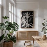 Flower Dreams BW II by Nathan Larson. shown as a print in a natural wood frame in a dining room. Available as a archival giclee rolled canvas, fine art paper, or poster print. SKU 103192h.