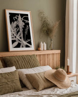 Flower Dreams BW II by Nathan Larson. shown as a paper print in a natural frame. Available as a archival giclee rolled canvas, fine art paper, or poster print. SKU 103192h.
