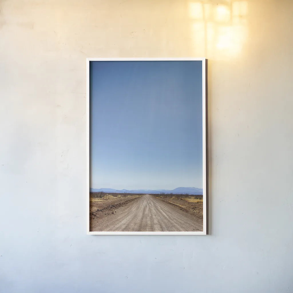 Follow Your Road by Nathan Larson. shown as a paper print in a white frame. Available as a archival giclee rolled canvas, fine art paper, or poster print. SKU 77275h.