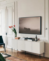 Following Along Sepia by Nathan Larson. shown as a framed stretched canvas in a living room above a console. Available as a archival giclee rolled canvas, fine art paper, or poster print. SKU 104269i.