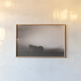 Following Along Sepia by Nathan Larson. shown as a paper print in a natural frame. Available as a archival giclee rolled canvas, fine art paper, or poster print. SKU 104269i.