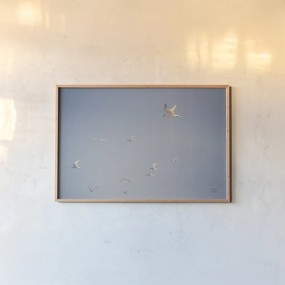 Georgia Seagulls II by Nathan Larson. shown as a paper print in a natural frame. Available as a archival giclee rolled canvas, fine art paper, or poster print. SKU 85271i.