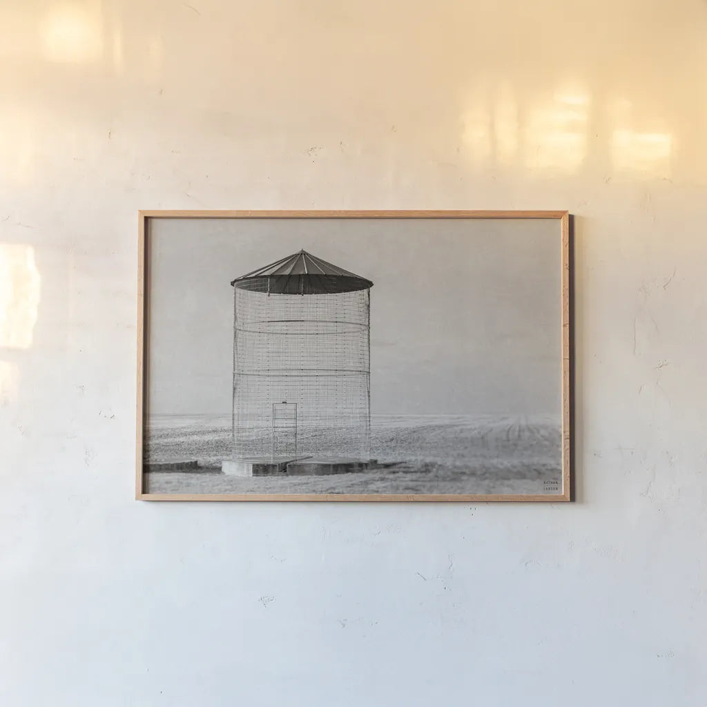 Ghost Silo by Nathan Larson. shown as a paper print in a natural frame. Available as a archival giclee rolled canvas, fine art paper, or poster print. SKU 98343i.