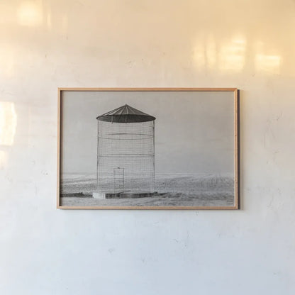 Ghost Silo by Nathan Larson. shown as a paper print in a natural frame. Available as a archival giclee rolled canvas, fine art paper, or poster print. SKU 98343i.