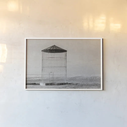 Ghost Silo by Nathan Larson. shown as a paper print in a white frame. Available as a archival giclee rolled canvas, fine art paper, or poster print. SKU 98343i.
