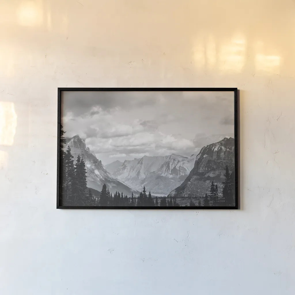 Glacier National Park Gateway BW by Nathan Larson. shown as a paper print in a black flame. Available as a archival giclee rolled canvas, fine art paper, or poster print. SKU 87647i.