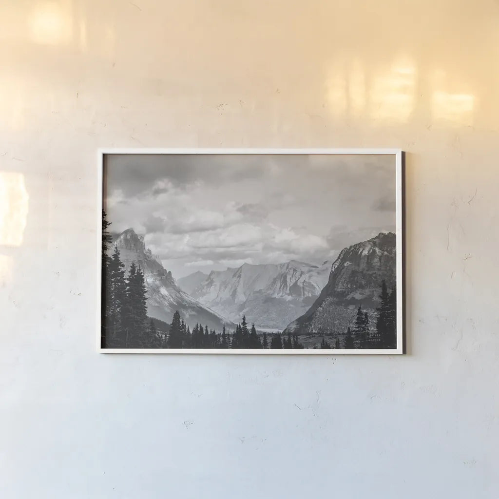 Glacier National Park Gateway BW by Nathan Larson. shown as a paper print in a white frame. Available as a archival giclee rolled canvas, fine art paper, or poster print. SKU 87647i.