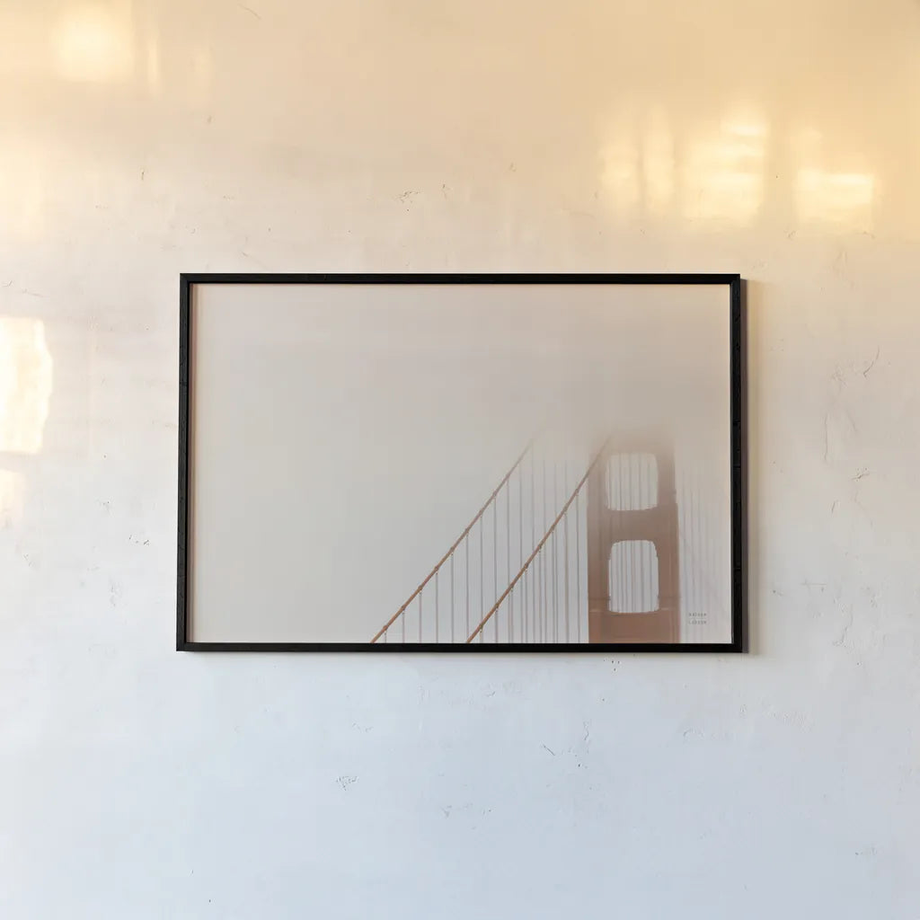 Golden Gate Fog by Nathan Larson. shown as a paper print in a black flame. Available as a archival giclee rolled canvas, fine art paper, or poster print. SKU 87945i.
