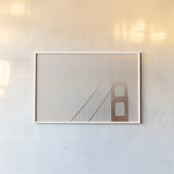 Golden Gate Fog by Nathan Larson. shown as a paper print in a white frame. Available as a archival giclee rolled canvas, fine art paper, or poster print. SKU 87945i.