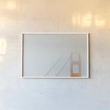 Golden Gate Fog Bright by Nathan Larson. shown as a paper print in a white frame. Available as a archival giclee rolled canvas, fine art paper, or poster print. SKU 87946i.