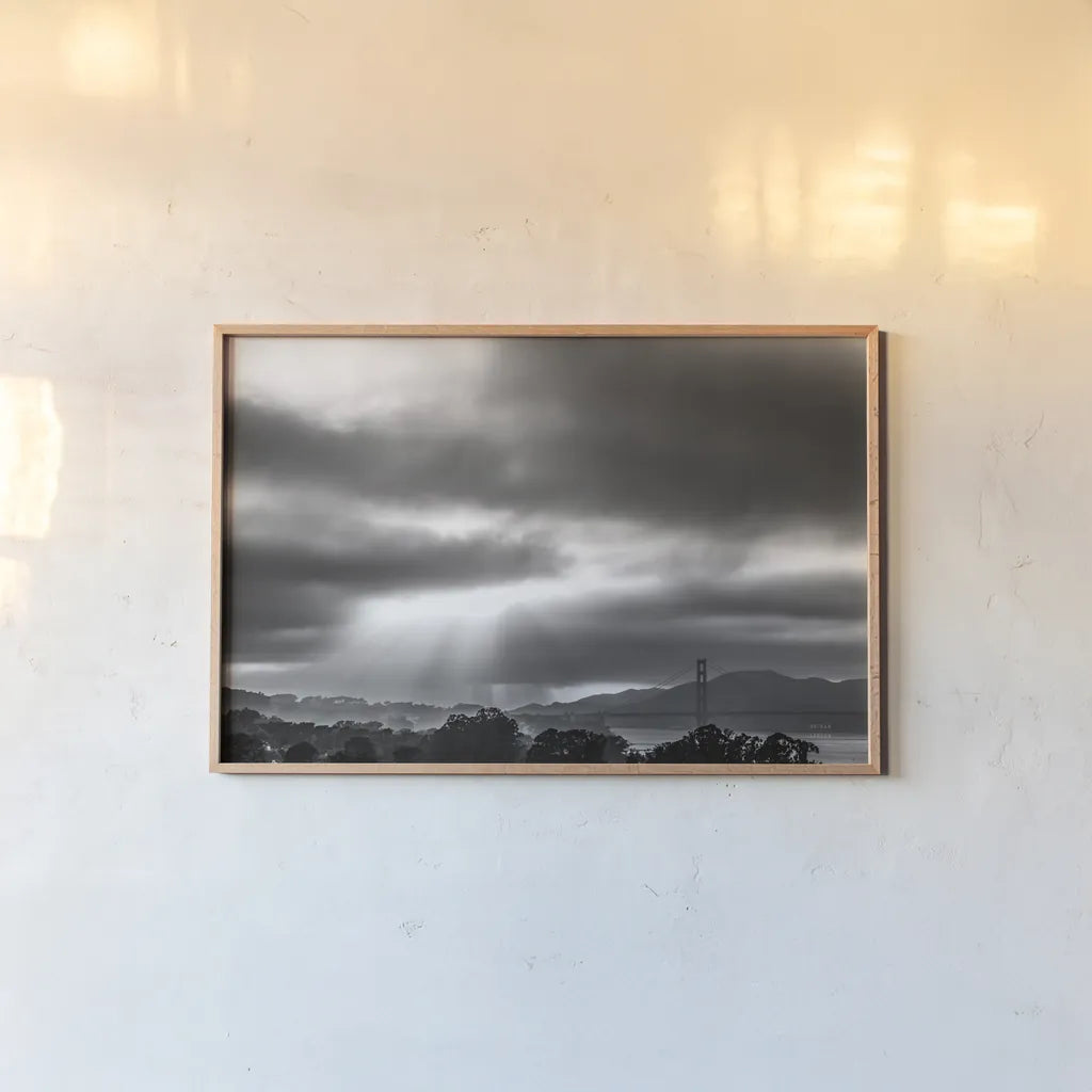 Golden Gate Rays by Nathan Larson. shown as a paper print in a natural frame. Available as a archival giclee rolled canvas, fine art paper, or poster print. SKU 86713i.