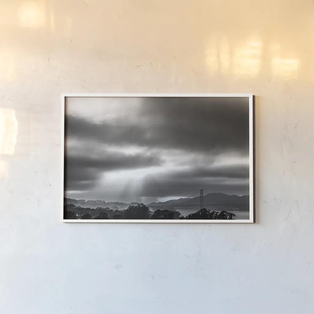 Golden Gate Rays by Nathan Larson. shown as a paper print in a white frame. Available as a archival giclee rolled canvas, fine art paper, or poster print. SKU 86713i.