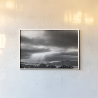 Golden Gate Rays by Nathan Larson. shown as a paper print in a white frame. Available as a archival giclee rolled canvas, fine art paper, or poster print. SKU 86713i.