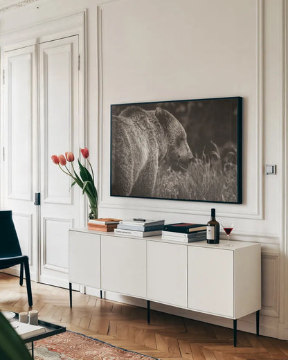 Grizzly Profile BW by Nathan Larson. shown as a framed stretched canvas in a living room above a console. Available as a archival giclee rolled canvas, fine art paper, or poster print. SKU 92571i.