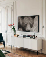 Hello Bear by Nathan Larson. shown as a framed stretched canvas in a living room above a console. Available as a archival giclee rolled canvas, fine art paper, or poster print. SKU 100755i.