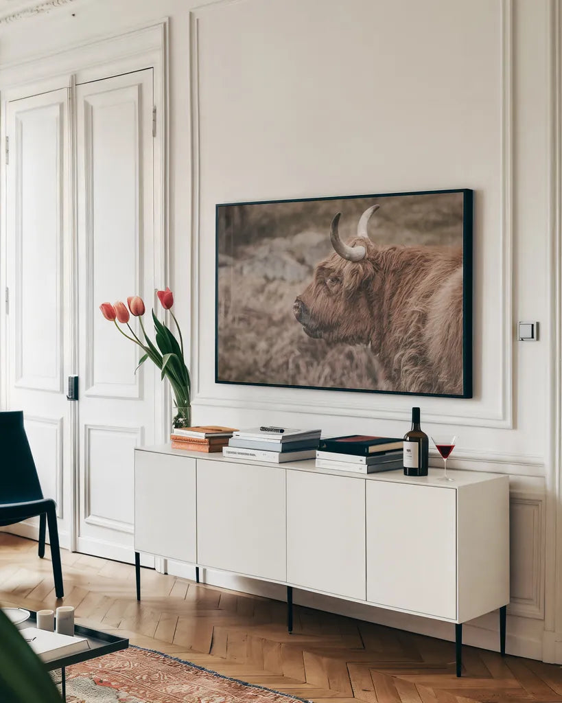 Highland Cow on Watch Faded by Nathan Larson. shown as a framed stretched canvas in a living room above a console. Available as a archival giclee rolled canvas, fine art paper, or poster print. SKU 79110i.
