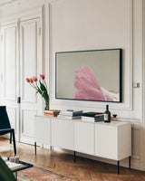 Hollyhock Edge by Nathan Larson. shown as a framed stretched canvas in a living room above a console. Available as a archival giclee rolled canvas, fine art paper, or poster print. SKU 81198i.