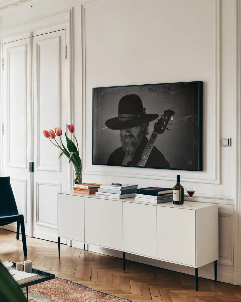Home on the Range Cowboy I by Nathan Larson. shown as a framed stretched canvas in a living room above a console. Available as a archival giclee rolled canvas, fine art paper, or poster print. SKU 77195i.