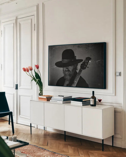 Home on the Range Cowboy I by Nathan Larson. shown as a framed stretched canvas in a living room above a console. Available as a archival giclee rolled canvas, fine art paper, or poster print. SKU 77195i.