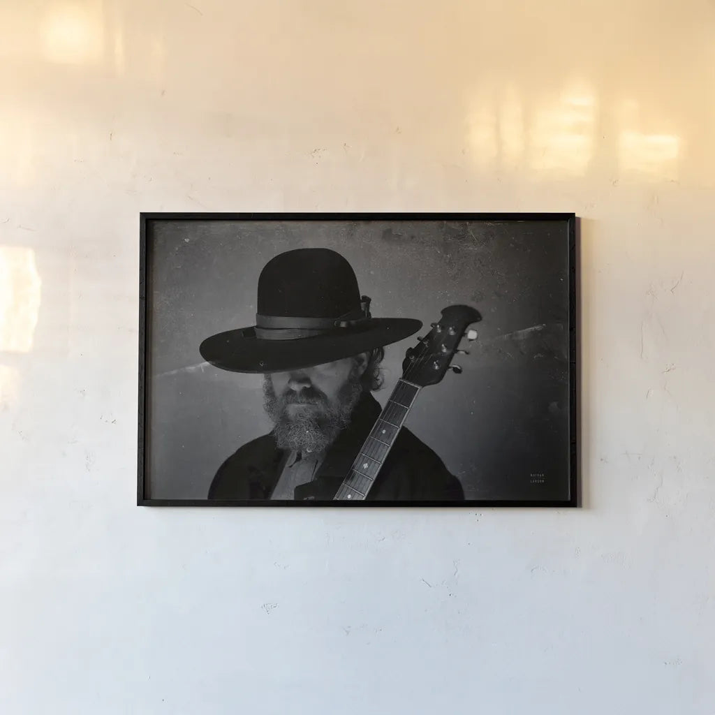 Home on the Range Cowboy I by Nathan Larson. shown as a paper print in a black flame. Available as a archival giclee rolled canvas, fine art paper, or poster print. SKU 77195i.