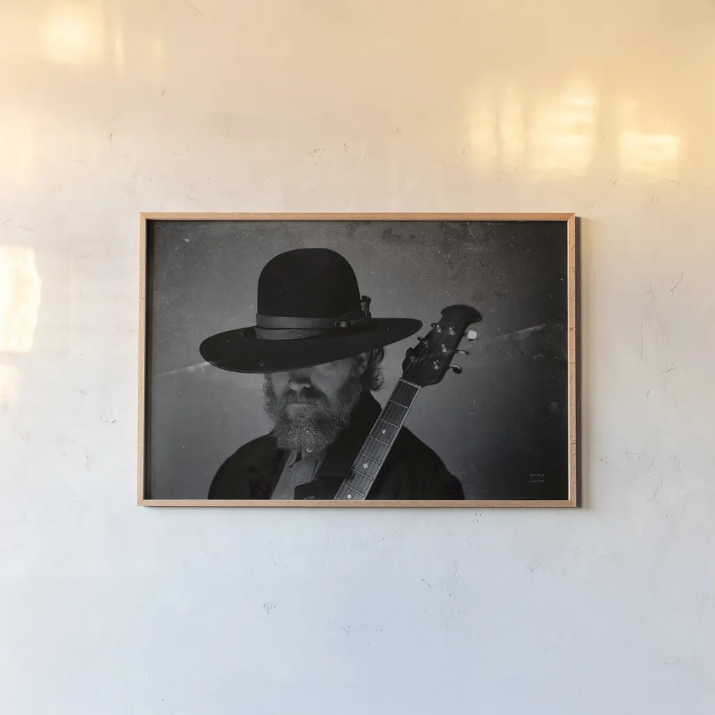 Home on the Range Cowboy I by Nathan Larson. shown as a paper print in a natural frame. Available as a archival giclee rolled canvas, fine art paper, or poster print. SKU 77195i.