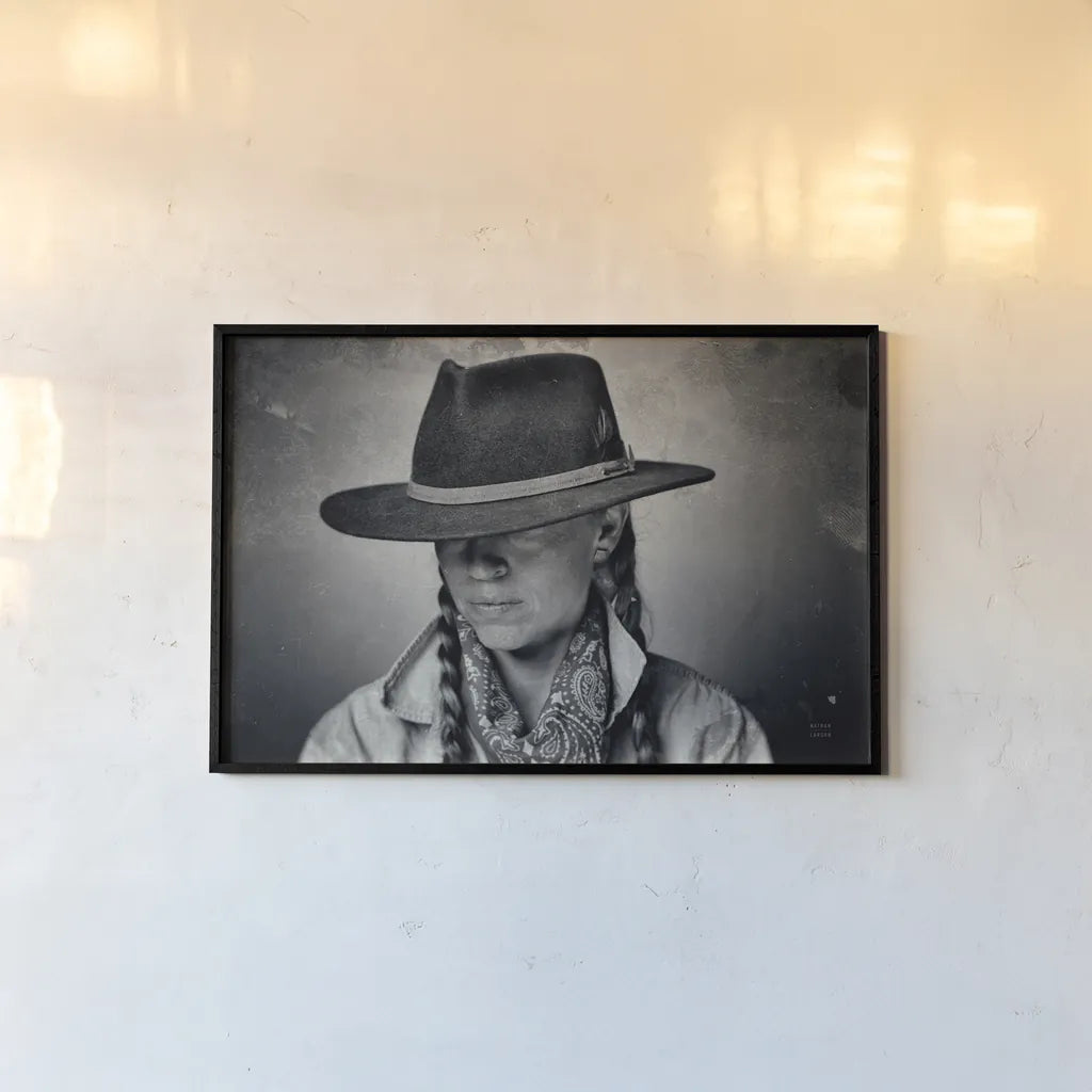 Home on the Range Cowgirl I by Nathan Larson. shown as a paper print in a black flame. Available as a archival giclee rolled canvas, fine art paper, or poster print. SKU 77197i.