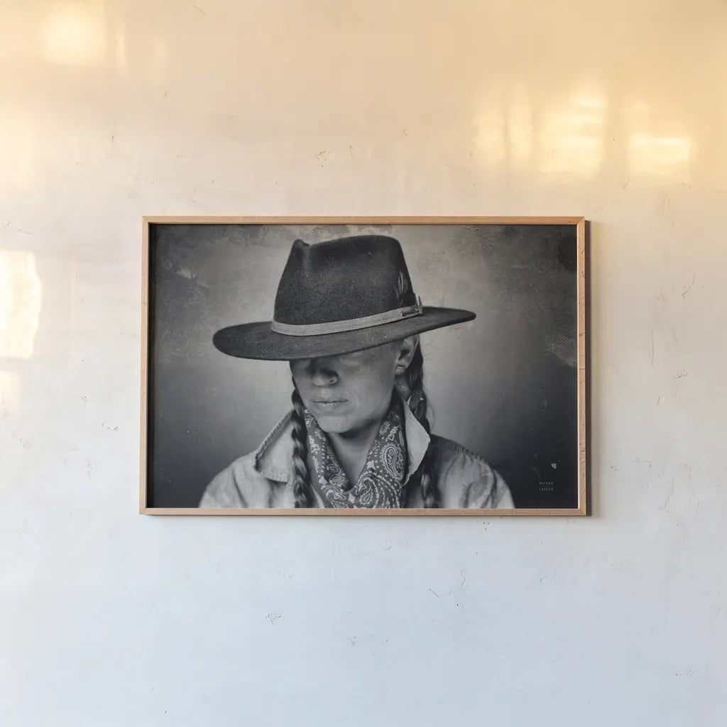 Home on the Range Cowgirl I by Nathan Larson. shown as a paper print in a natural frame. Available as a archival giclee rolled canvas, fine art paper, or poster print. SKU 77197i.
