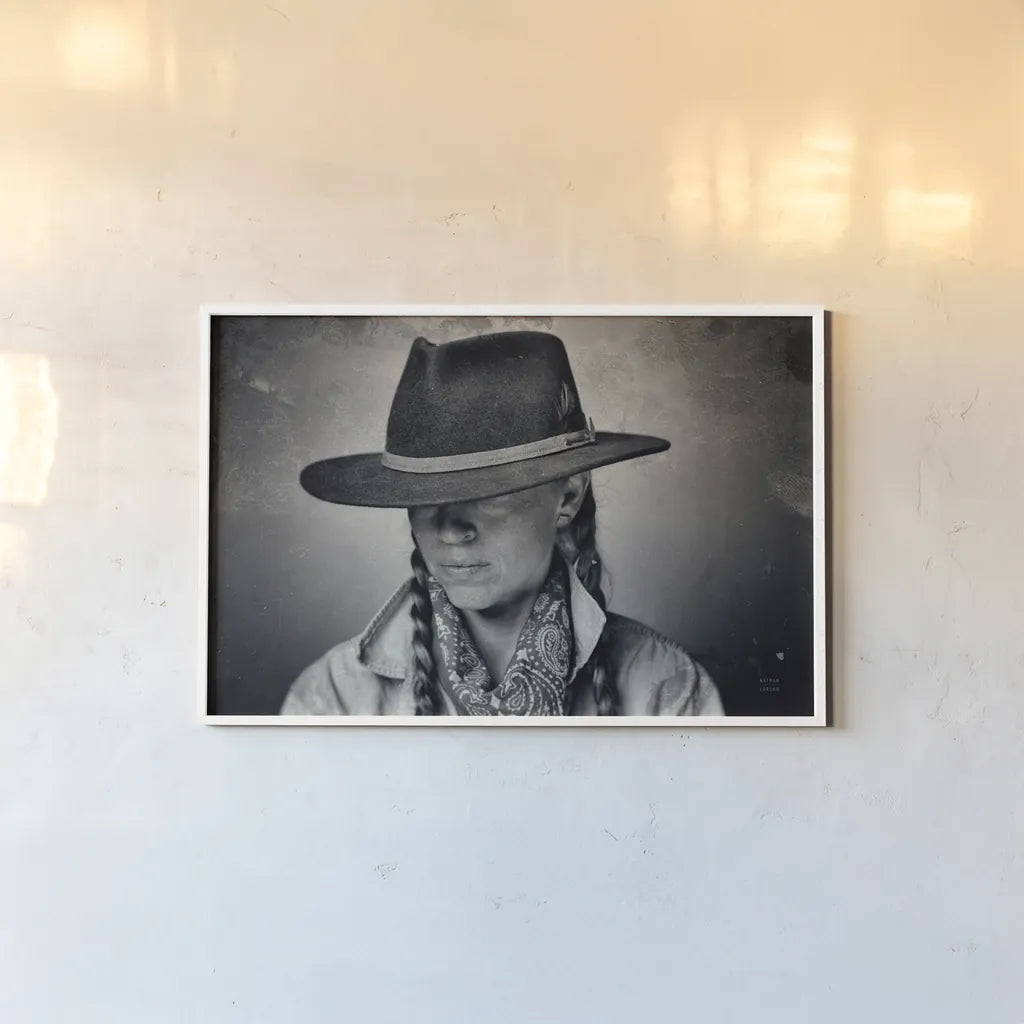 Home on the Range Cowgirl I by Nathan Larson. shown as a paper print in a white frame. Available as a archival giclee rolled canvas, fine art paper, or poster print. SKU 77197i.